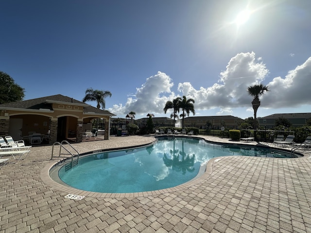 view of pool featuring a patio