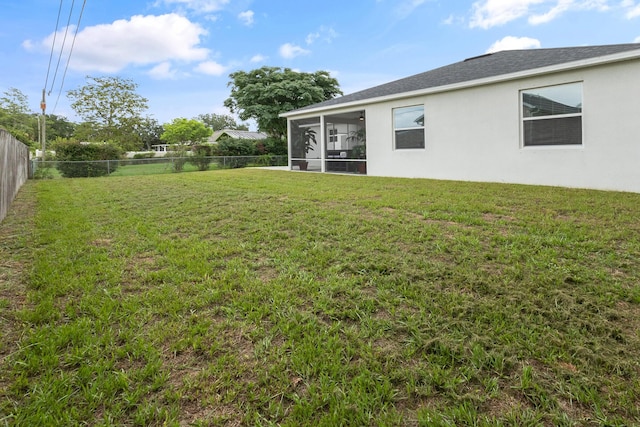 view of yard featuring a sunroom