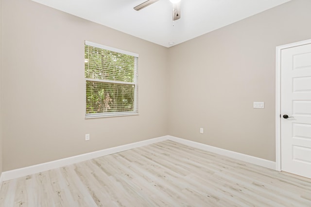 spare room featuring light wood-type flooring and ceiling fan