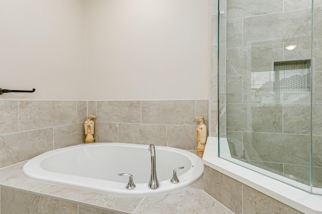 bathroom with tiled bath