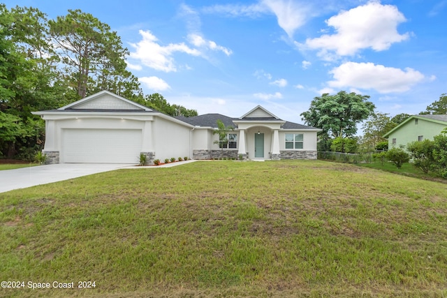 ranch-style house with a front yard and a garage