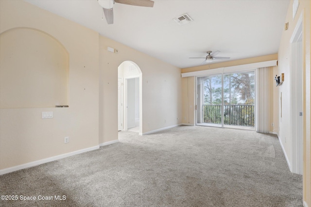 spare room featuring light colored carpet and ceiling fan