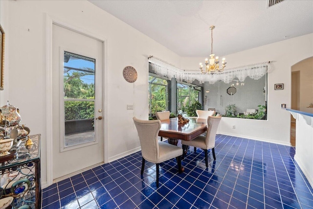 dining space featuring a chandelier