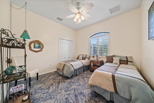 carpeted bedroom with a closet and ceiling fan