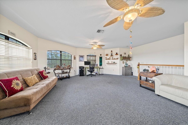 carpeted living room featuring ceiling fan