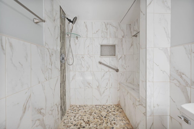 bathroom featuring toilet and tiled shower