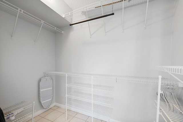 walk in closet featuring light tile patterned floors