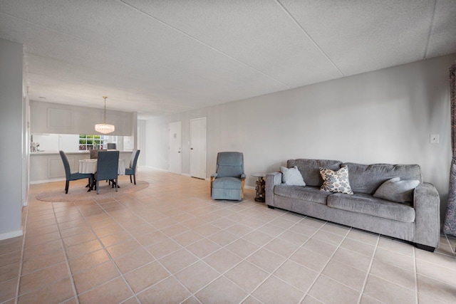 tiled living room featuring a textured ceiling