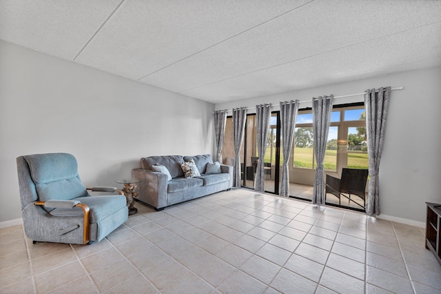 tiled living room with a textured ceiling