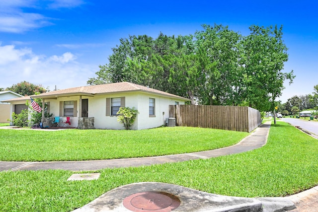 2442 Dianne Dr, Cocoa, FL 32926 - view of property exterior featuring central AC unit and stucco siding