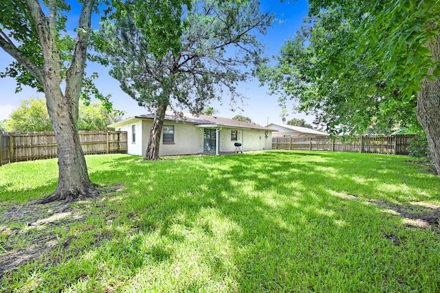 2442 Dianne Dr, Cocoa, FL 32926 - rear view of house with stucco siding