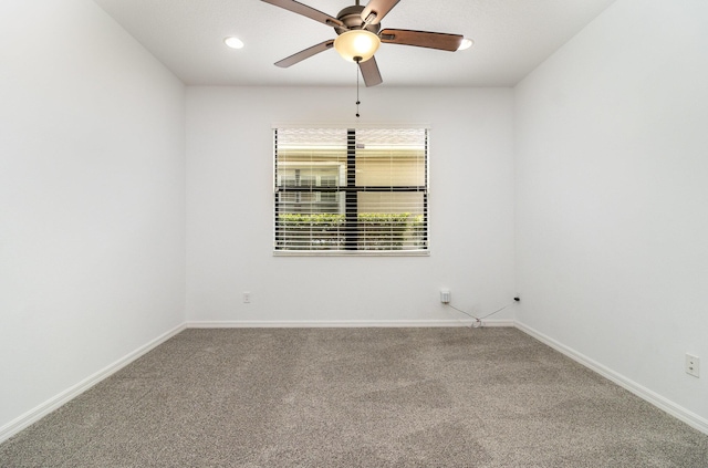 unfurnished room featuring ceiling fan and carpet floors