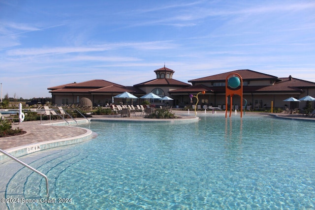 view of swimming pool featuring a patio area