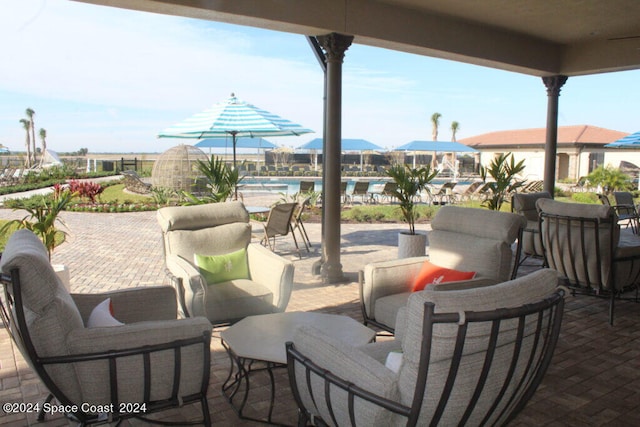 view of patio featuring a community pool