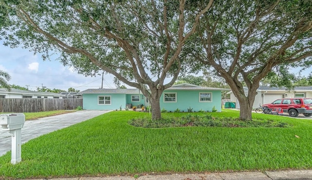 ranch-style home featuring a front lawn