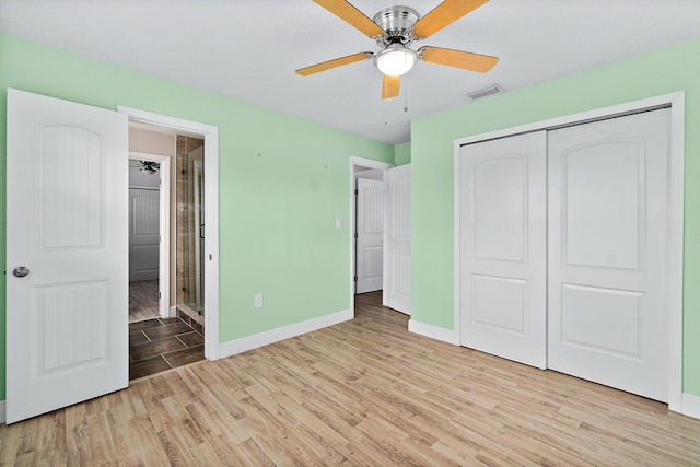 unfurnished bedroom with a closet, ceiling fan, and light hardwood / wood-style flooring