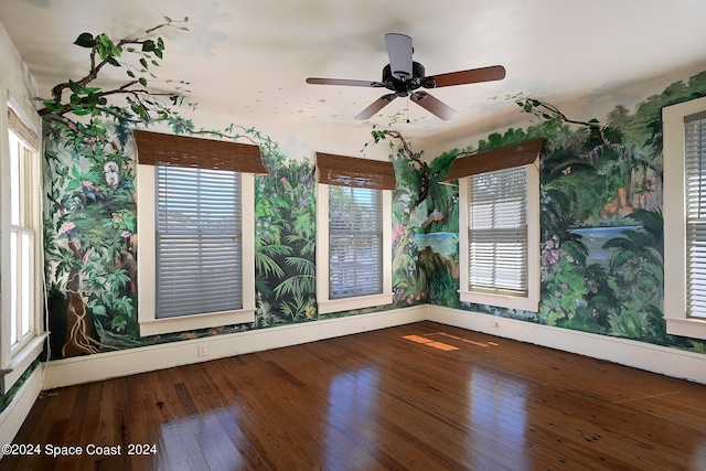 empty room with ceiling fan and plenty of natural light