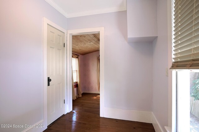 corridor featuring ornamental molding, wooden ceiling, and dark hardwood / wood-style flooring