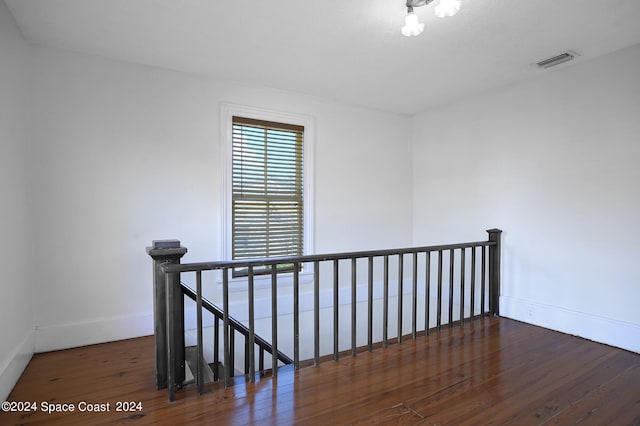 hallway featuring dark wood-type flooring