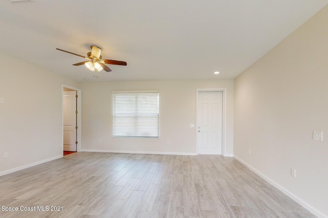 1071 Grapefruit Rd SE, Palm Bay, FL 32909 - empty room with a ceiling fan, light wood finished floors, and recessed lighting