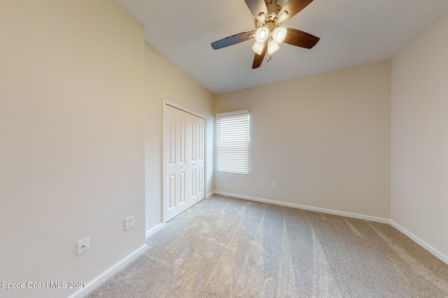 1071 Grapefruit Rd SE, Palm Bay, FL 32909 - unfurnished bedroom featuring carpet floors, a closet, and a ceiling fan