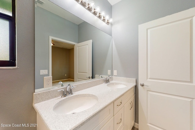 bathroom with double sink vanity