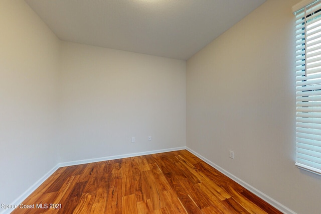 empty room with wood-type flooring