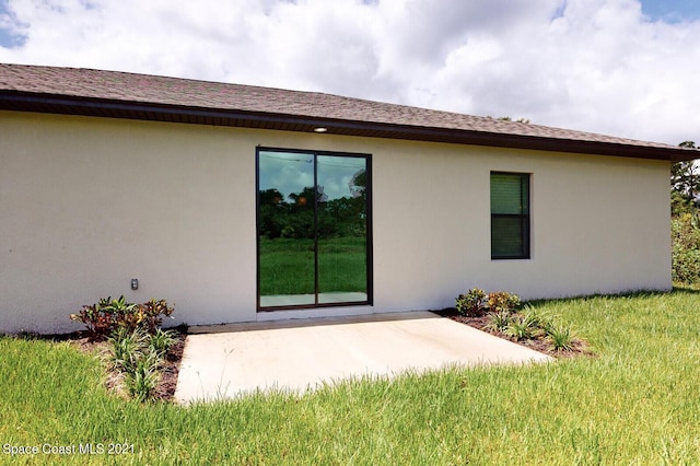 1071 Grapefruit Rd SE, Palm Bay, FL 32909 - rear view of property featuring a patio and stucco siding