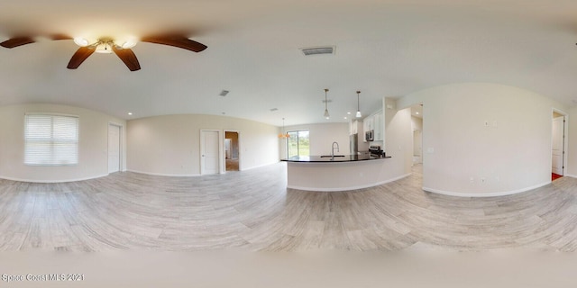 1071 Grapefruit Rd SE, Palm Bay, FL 32909 - unfurnished living room featuring a ceiling fan, light wood-style flooring, and recessed lighting