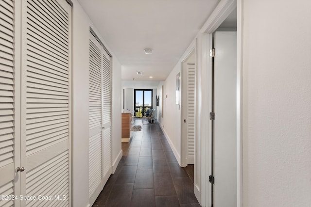 hallway featuring dark wood-type flooring