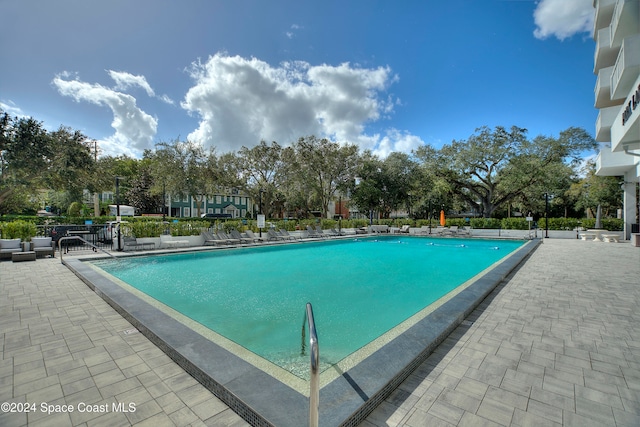 view of swimming pool featuring a patio