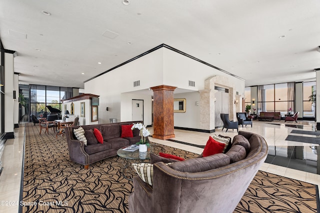 tiled living room featuring decorative columns