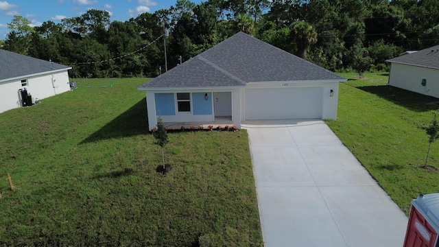 view of front of property featuring a garage and a front yard