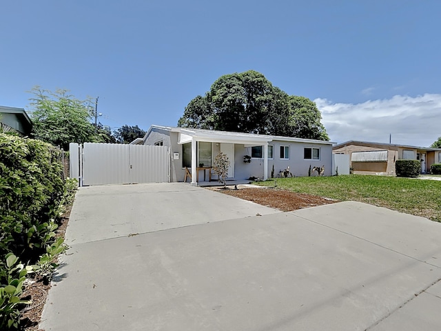 manufactured / mobile home featuring covered porch and a front yard