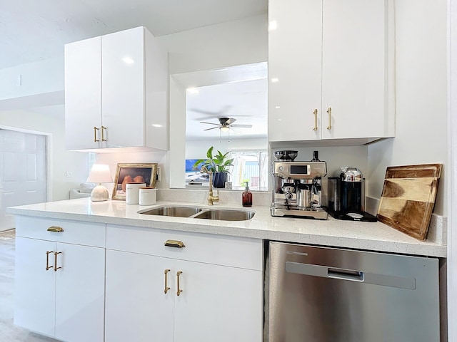 kitchen featuring dishwasher, white cabinetry, ceiling fan, and sink