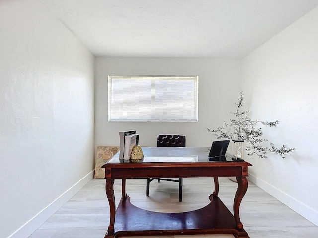 home office with light wood-type flooring