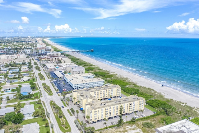 aerial view featuring a water view and a view of the beach