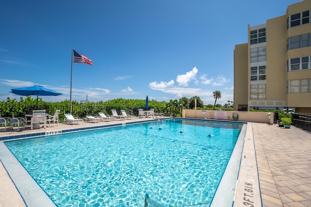 view of swimming pool featuring a patio