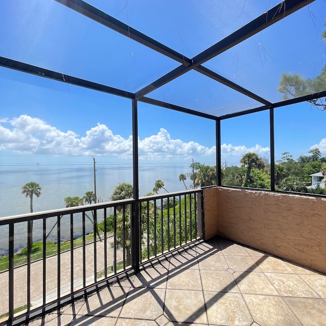 exterior space with a balcony and a water view