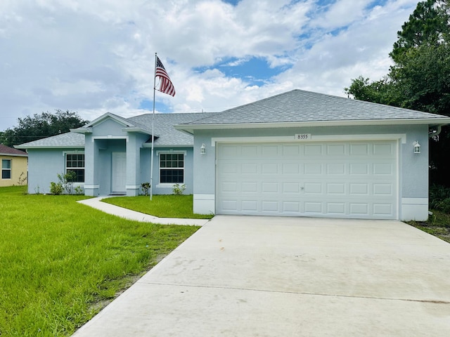 single story home with a front yard and a garage