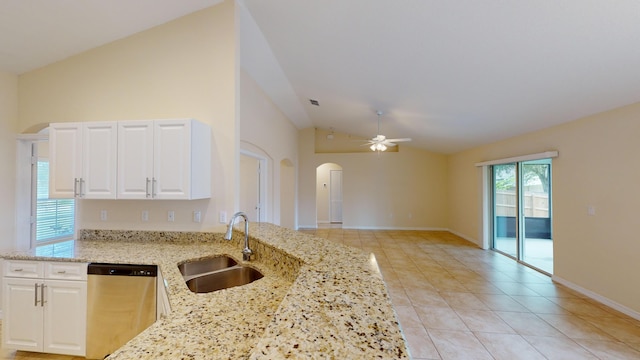 kitchen with lofted ceiling, sink, stainless steel dishwasher, ceiling fan, and light stone countertops