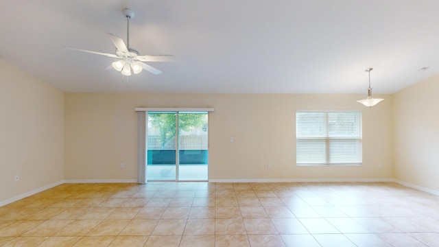 tiled empty room with ceiling fan