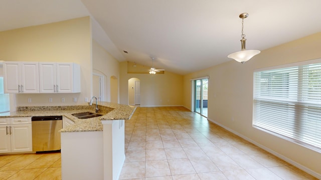 kitchen with kitchen peninsula, sink, decorative light fixtures, dishwasher, and lofted ceiling