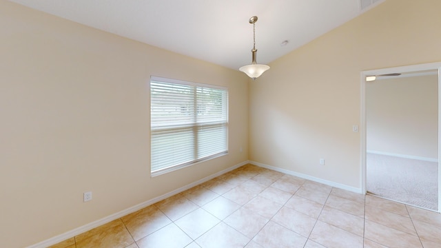 spare room featuring light tile patterned flooring