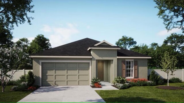 view of front of home with a garage and a front lawn