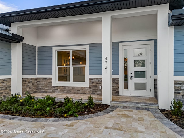 entrance to property with covered porch