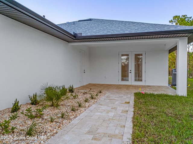 property entrance with french doors and a patio