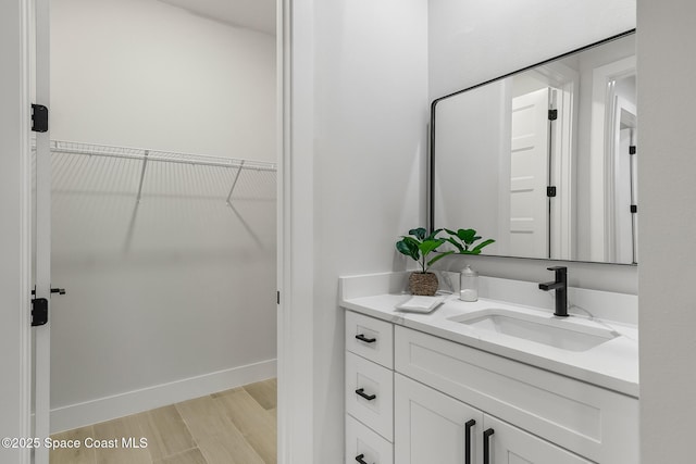 bathroom with vanity and hardwood / wood-style flooring