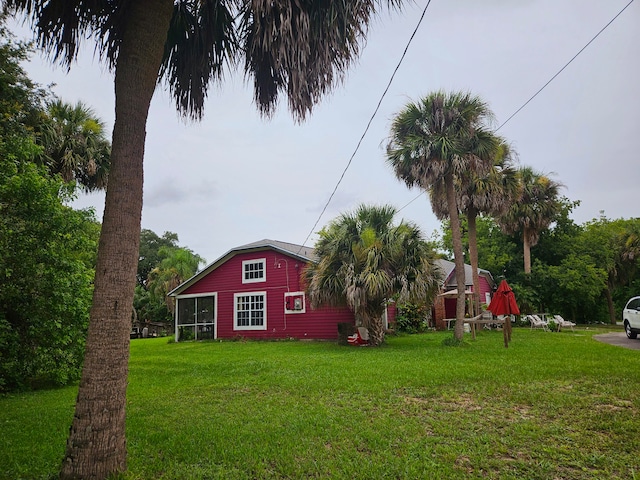 view of yard featuring a sunroom