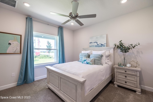 bedroom with dark colored carpet and ceiling fan